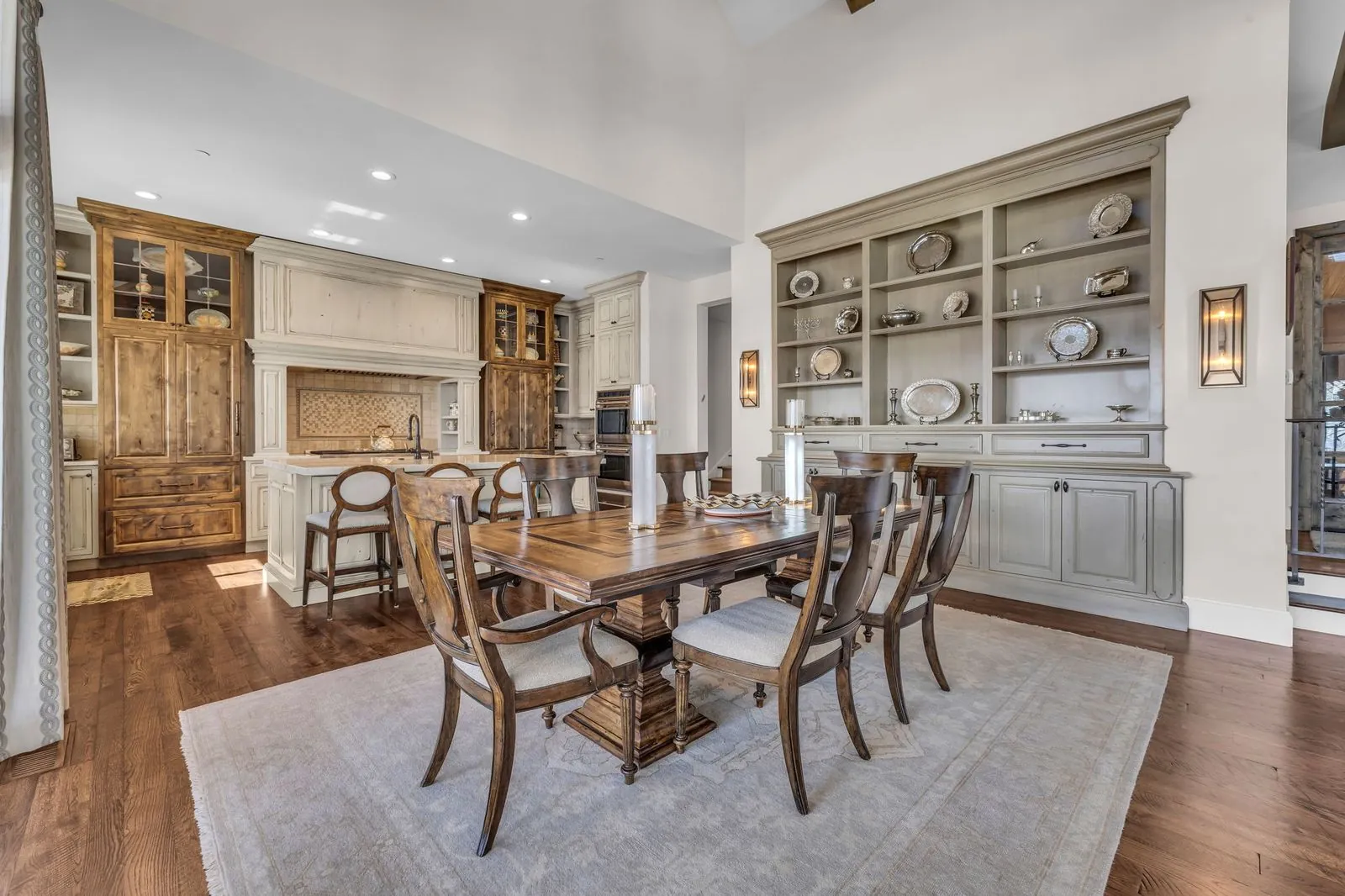 Dining room with a wood table and a painted built-in hutch