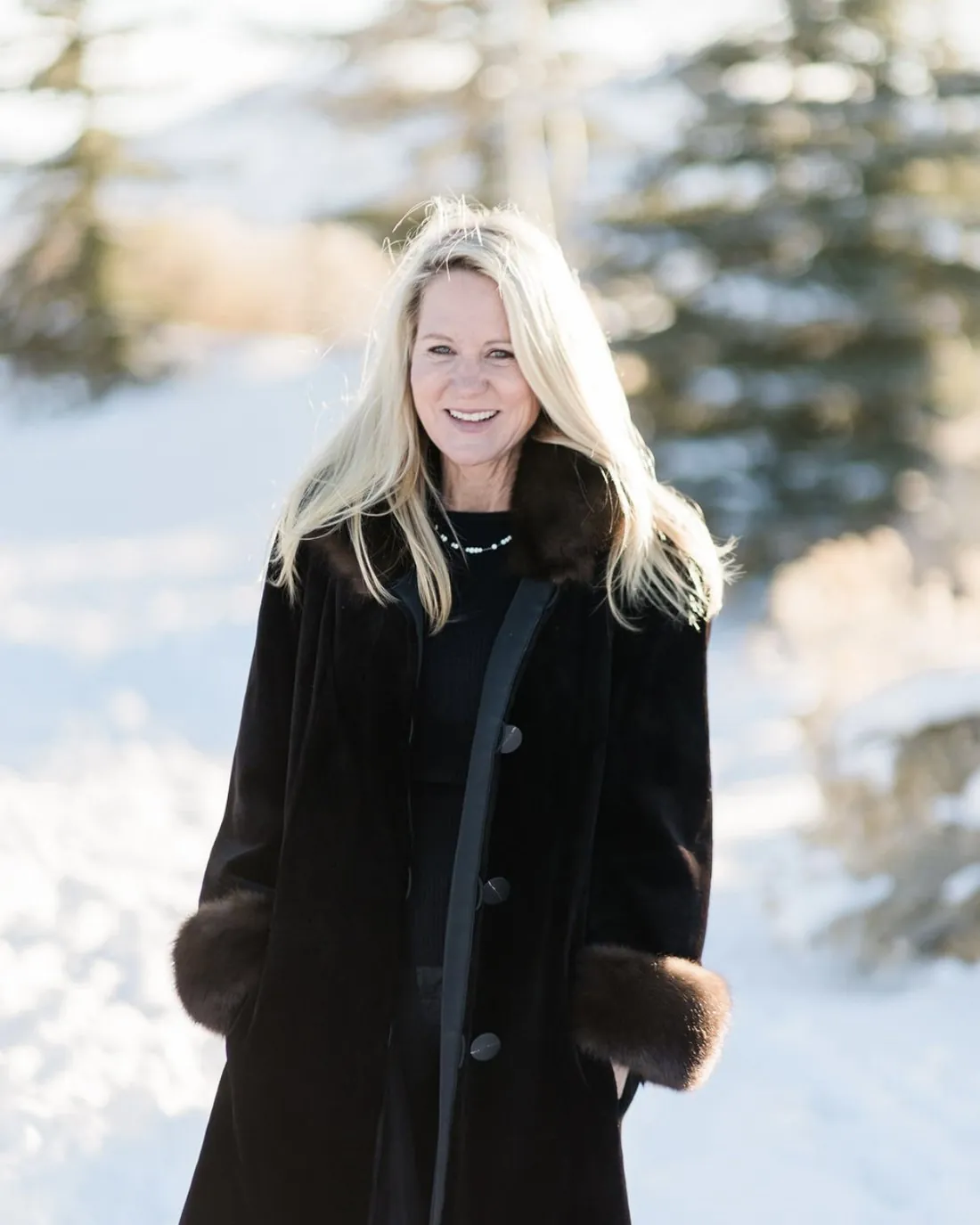 Natalie Siegel smiling outdoors in the snow